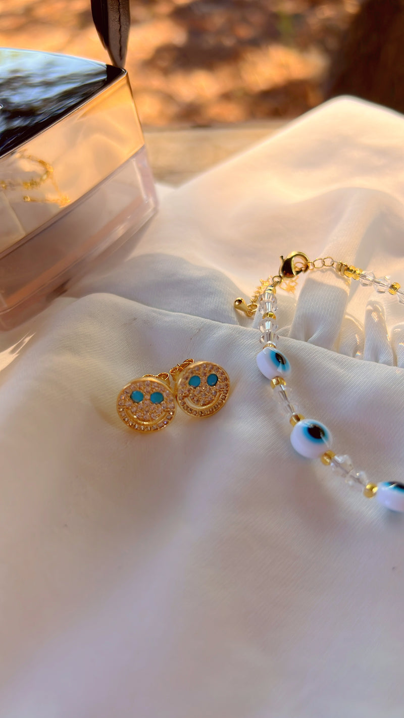 Aretes con cara sonriente (azul)